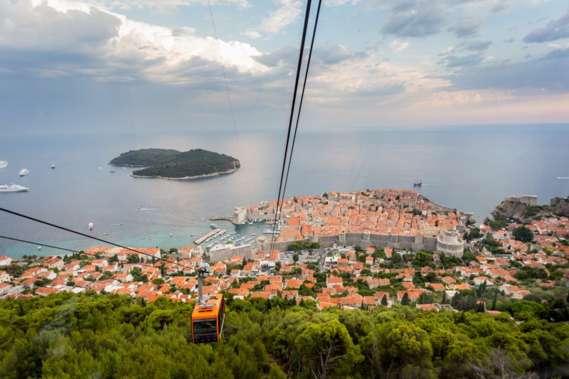 Experience the charming cable car ride to Srđ, offering spectacular panoramic views of Dubrovnik