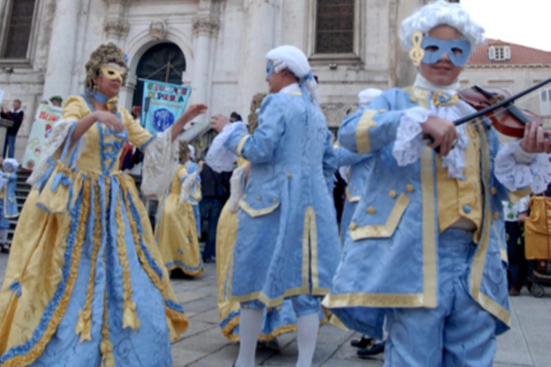 Costumed waltz on Stradun along with a performance of the Dubrovnik Marching Band and the Carnival band